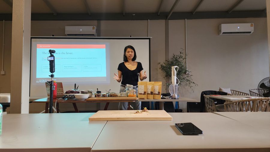 Tammie presenting to a workshop group in a bright room
